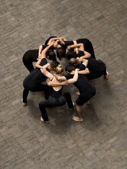 Image: Artists huddled together