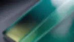 Close-up view of powder-coated glass piece with a smooth finish