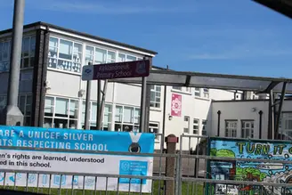 Kirklandneuk Primary School sign with banner: