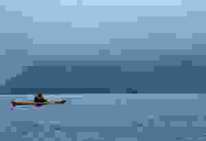Sea kayaking under the misty mountains