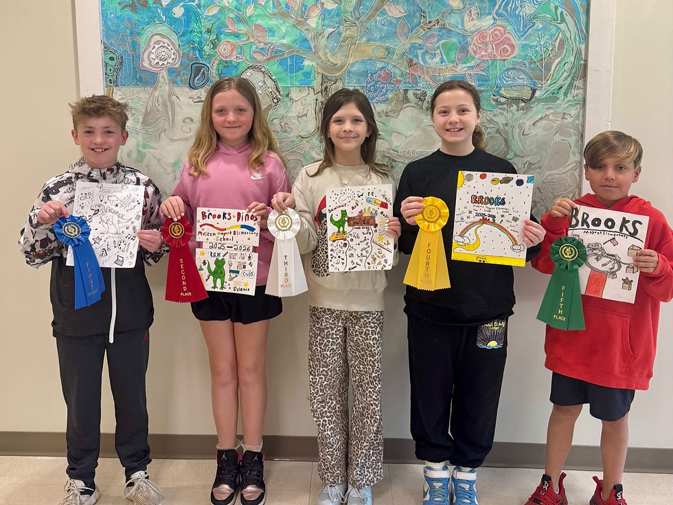 A photo of the winners of the yearbook cover design contest, with their designs.