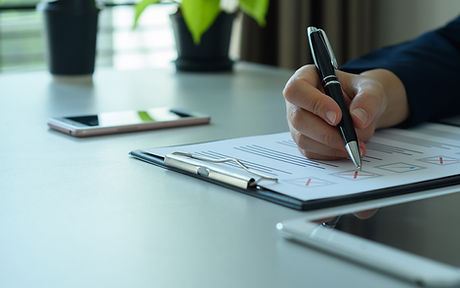 Businessman checks documents, marking right and wrong. Quality assurance. Symbol of excell