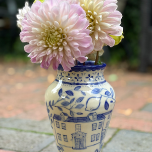 blue and white vase with dahlias