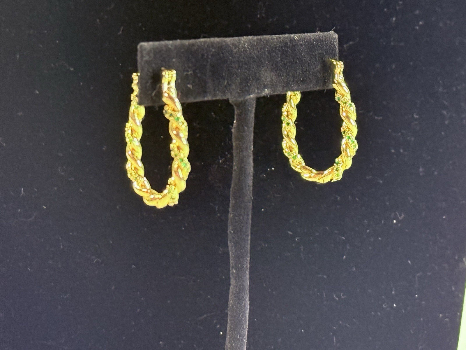 New Gold Toned Twisted Hoop Earrings With Green Stones Accents