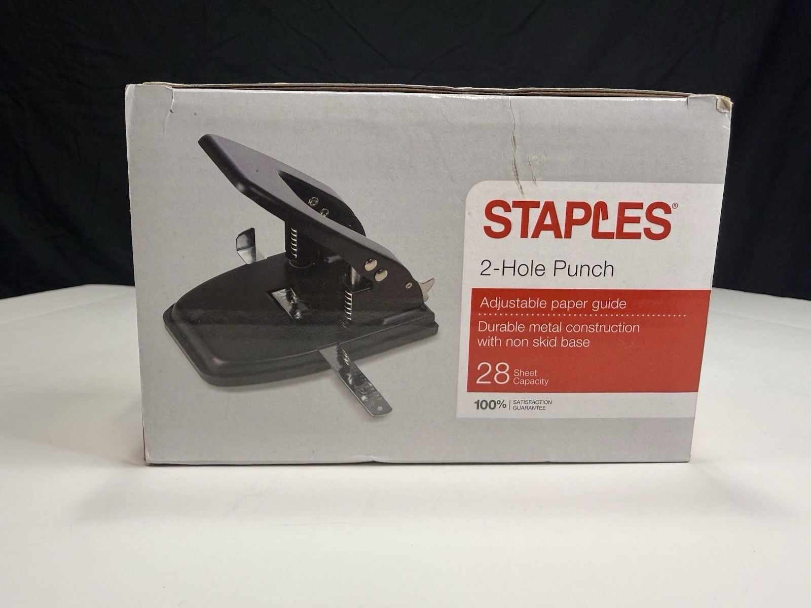 Staples 2-hole punch (28-sheet capacity) Box was opened but contents are sealed