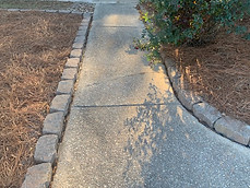 Install stone border around home and business foundation