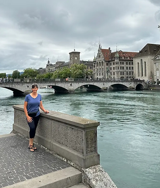 Female standing on the bridge overpass of the Seine River in Paris