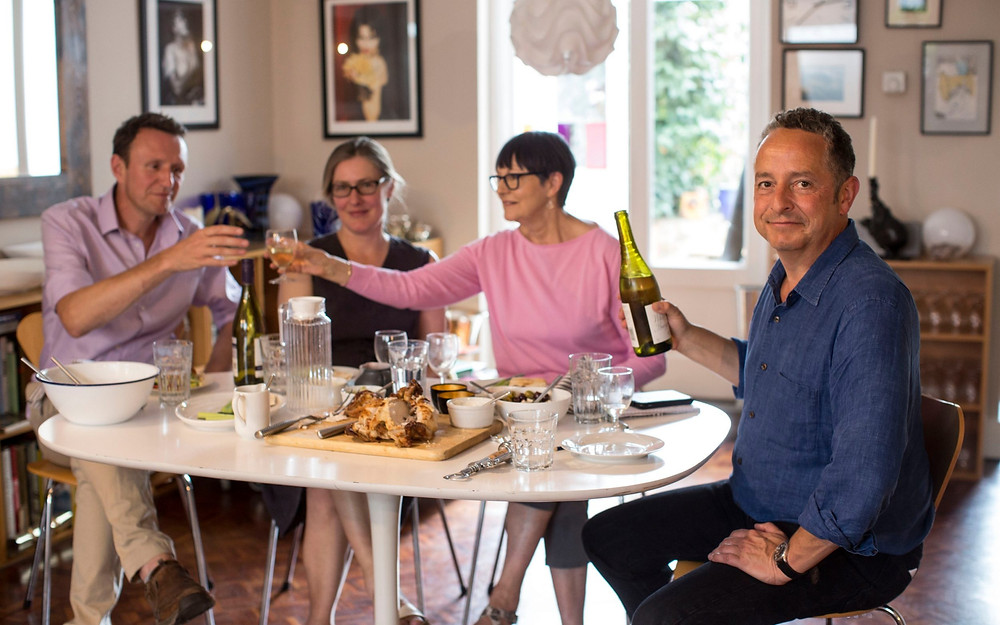 nick curtis the journalist eating lunch with friends while watching revels in hand perform at his home