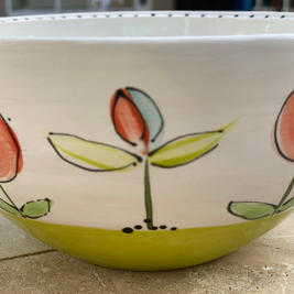 Side view of lime green flower bowl.
