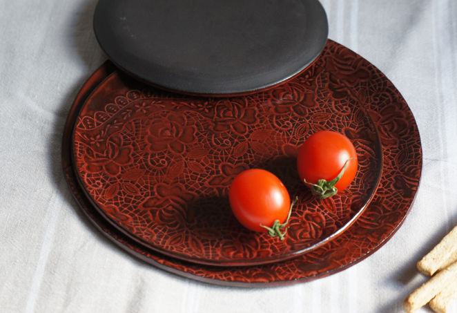 lace patterned cinnabar red coloured ceramic plates made with black clay