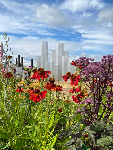Contemporary sculpture with plants and flowers. RHS Tatton Park