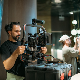 Director of photography with a camera in his hands on the set. Professional videographer a