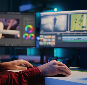 Video editor arranging recorded stock clips into seamless whole in creative multimedia age