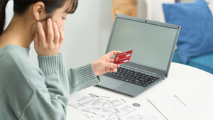 woman-reviewing-online-payments-credit-card-bill-management