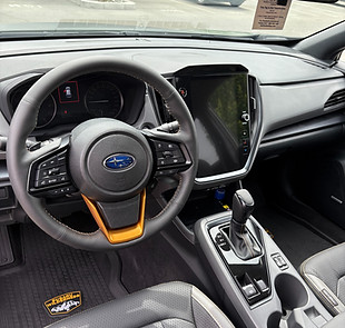 Steering wheel and center console of a freshly cleaned Subaru Crosstrek to show off the Signature Detail