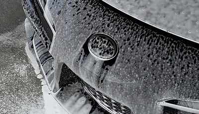 Front end of toyota supra with foaming soap on it