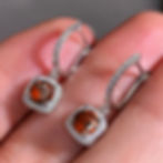Clear cubic zirconia square drop earrings displayed front and back