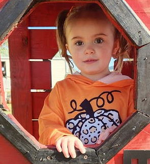 Avrie in pumpkin shirt.jpeg