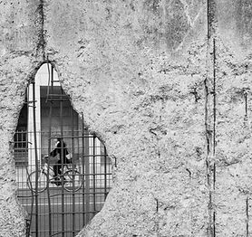 Cyclist Through Rubble