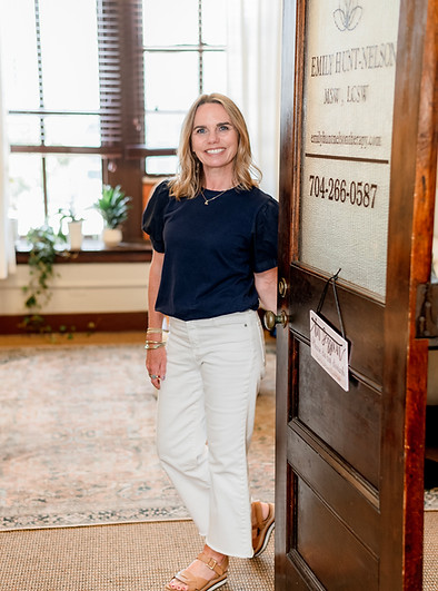Emily standing in the front door to the office