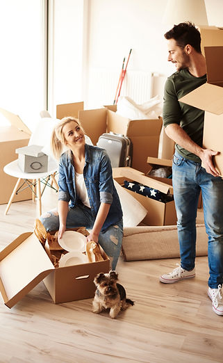 Couple Taking Stuff out of Boxes | Mayberry Communities LLC | Rent-To-Own Program in Colorado Springs