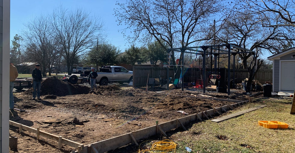 Setting forms and dirt work for detached garage and studio apartment.