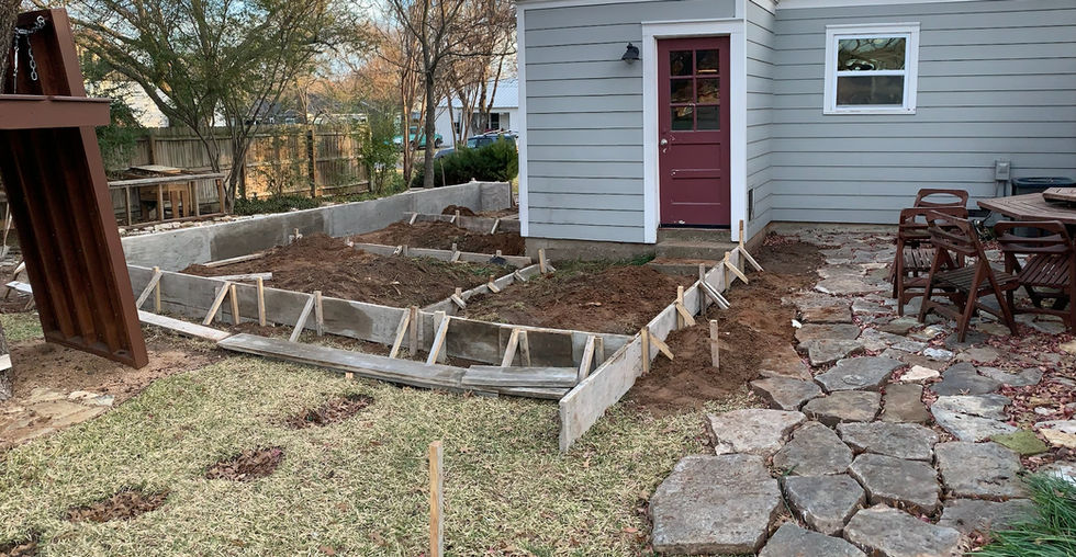 Setting concrete forms for rear addition.
