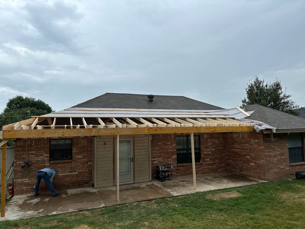 a brick house with a roof that is being built