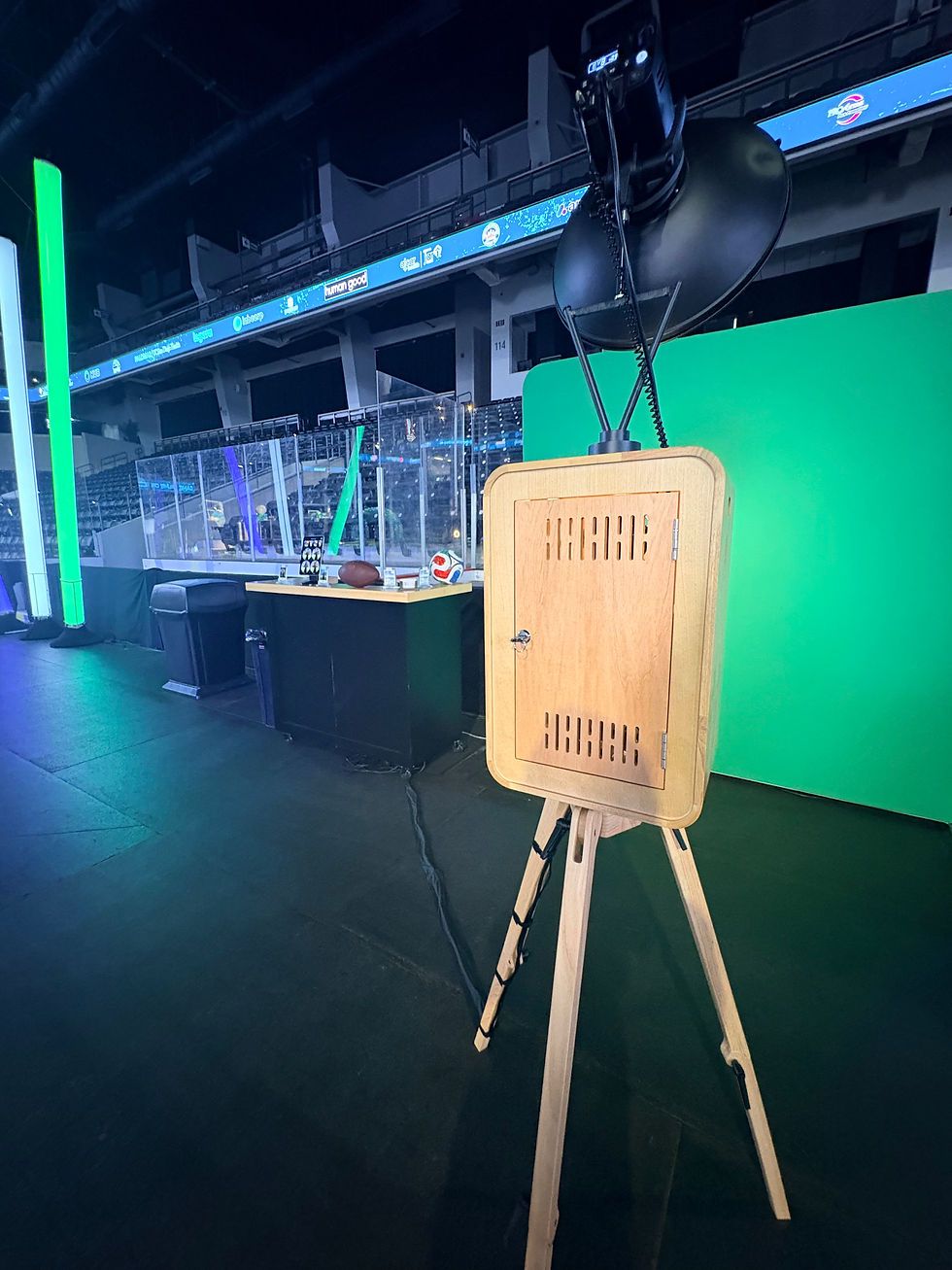 A photobooth with a green screen and Bar for the trading card activation
