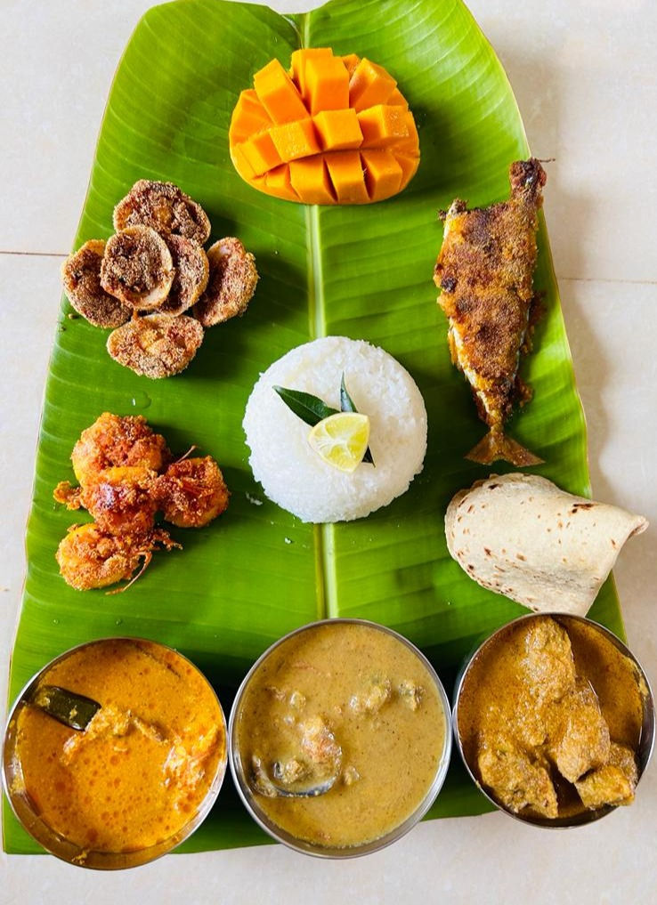Goan dishes served on a banana leaf