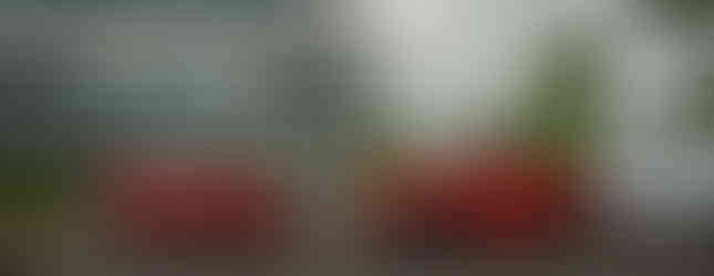 Chevrolet Silverado EV and Blazer EV in front of the Flo offices