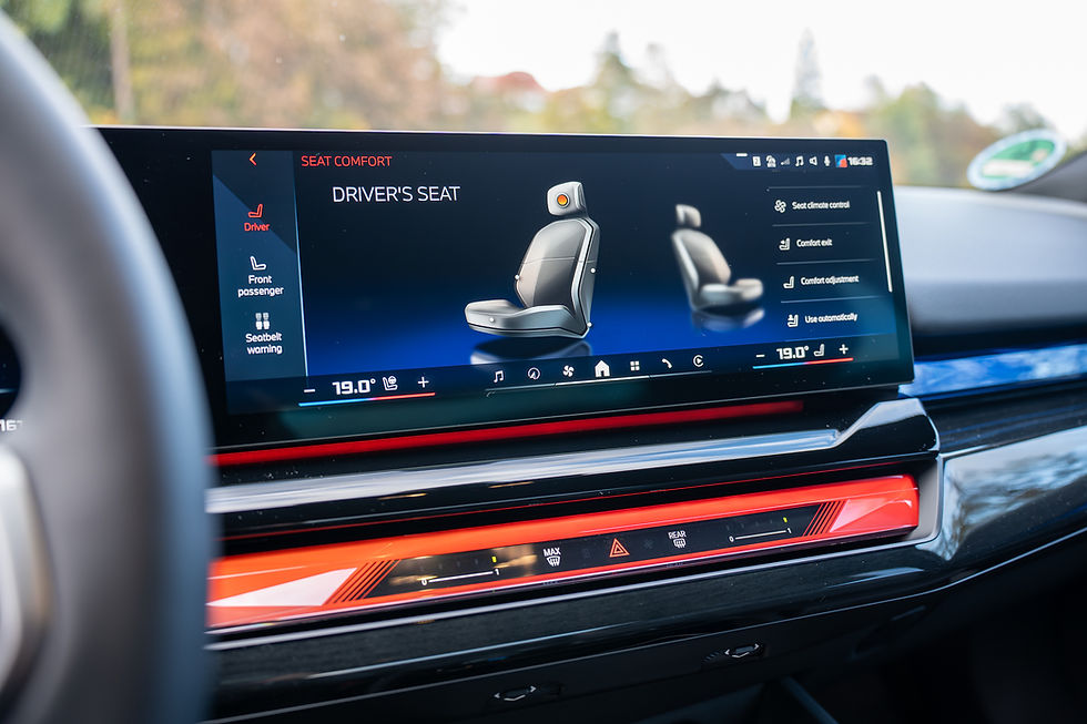 2026 BMW i5 M60 - Car dashboard display shows seat adjustment options for driver's seat. Blue and red interface with icons and 19.0° temperature setting.