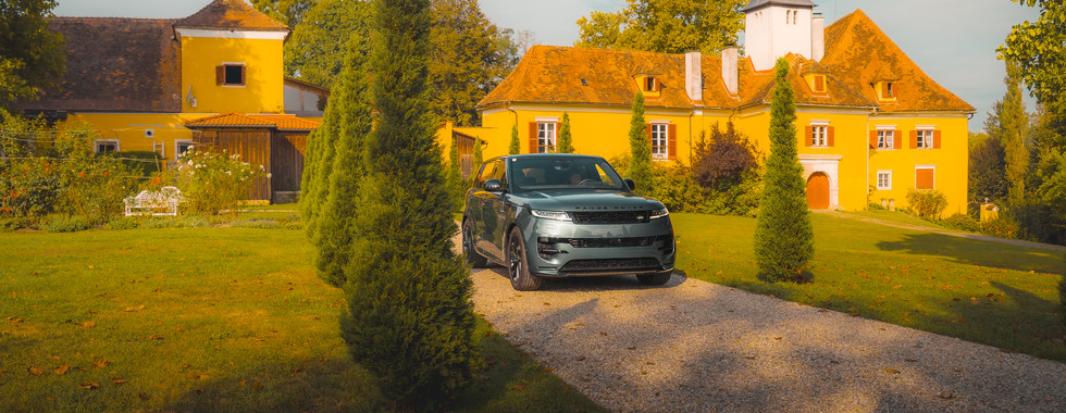Range Rover Sport P460e behind a castle