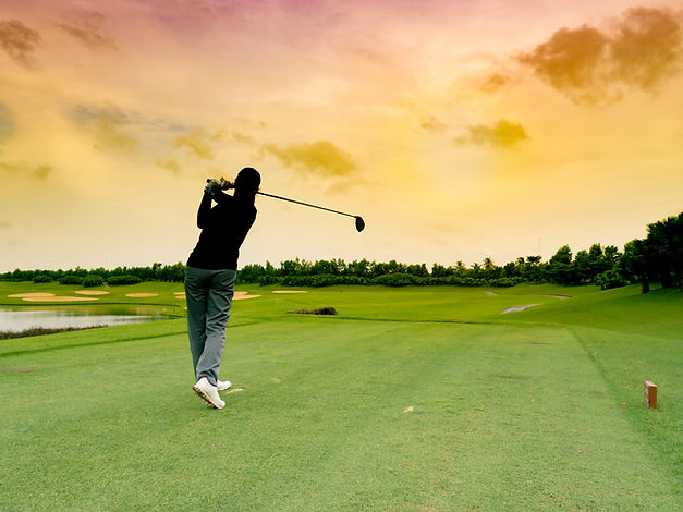 Lady golfer, girl golf player hit the golf ball with full swing, follow through on the tee