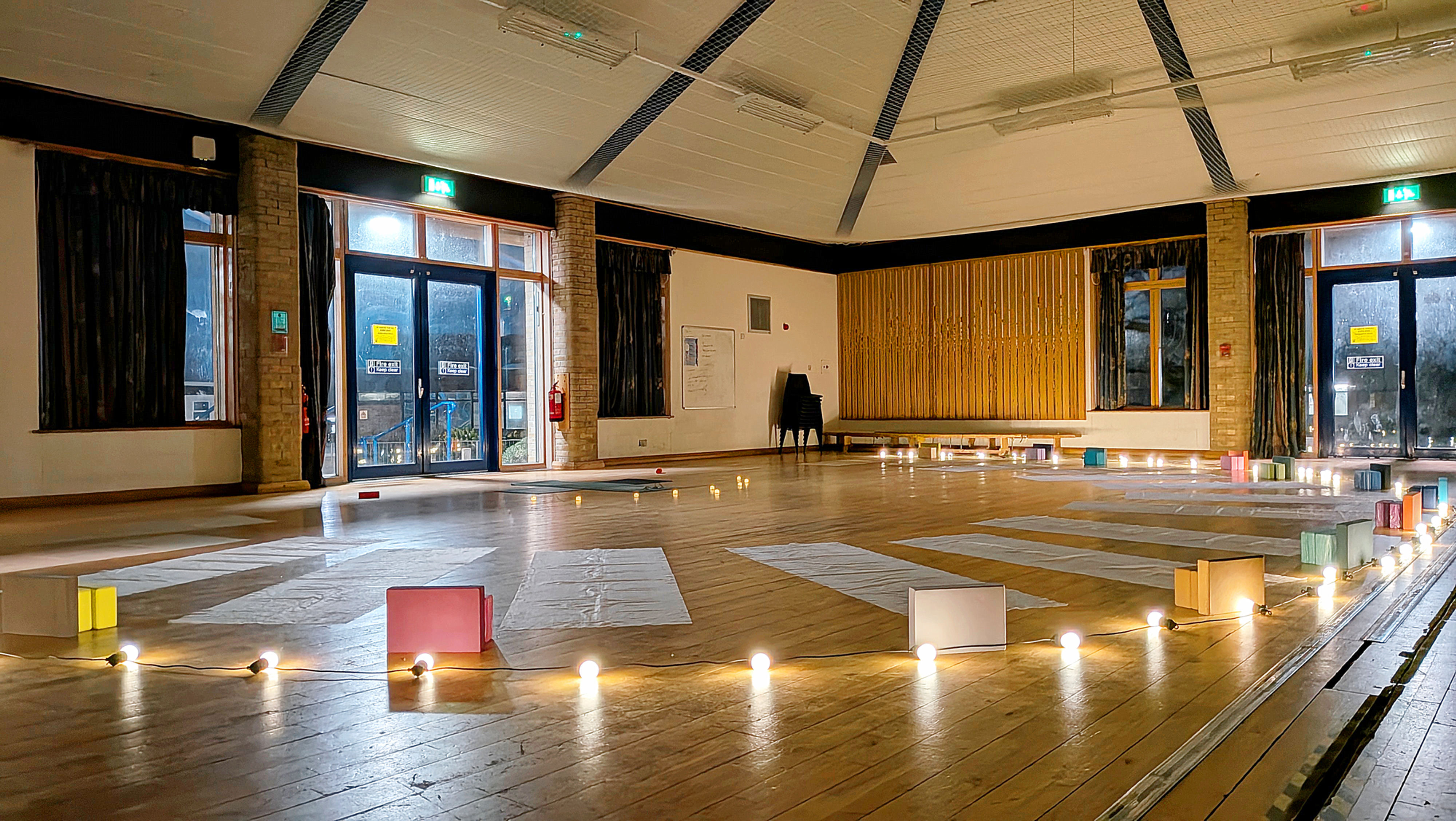 Beginner-friendly yoga class moving at a slow, mindful pace at the Haughley Pavillion.