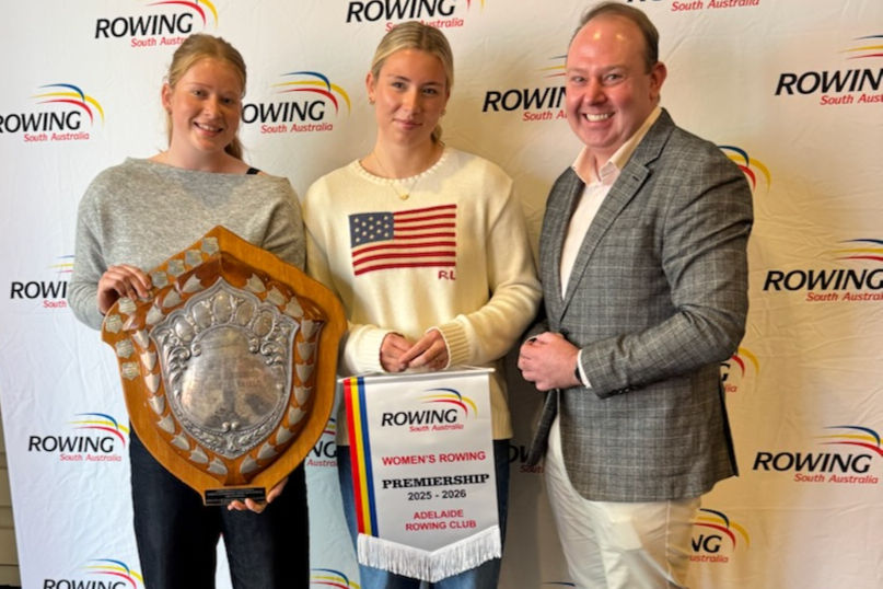 Tamara Bates & Grace Barrera receive the 2025-26 Premiership Pennant and Shield from The Honourable David Wilkins MP, Member for Lee