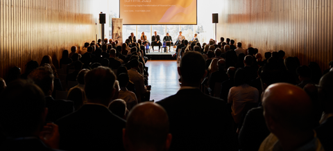 Audience at corporate keynote presentation – Raised Media Co