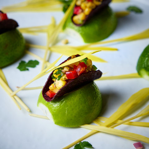 Bite-sized cucumber canapé with seared tuna and garnish – Raised Media Co