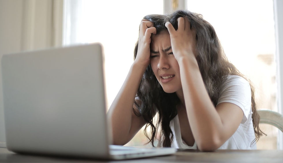 A woman who is frustrated about writing her own marketing content.