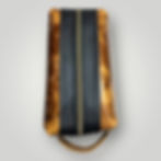 Cognac leather shaving kit with black leather along the zipper.