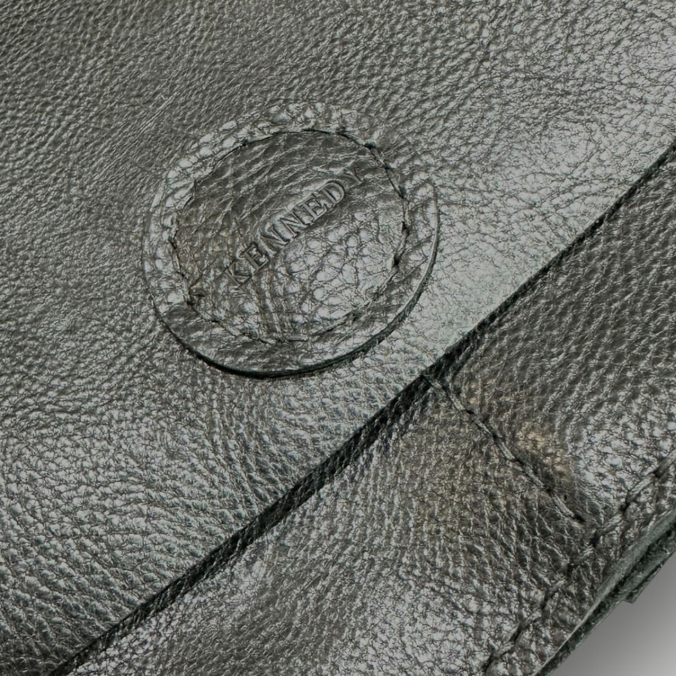 Thumbnail: A close up of the stitching on a handmade black leather shoulder bag.