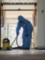 An asbestos worker removing asbestos