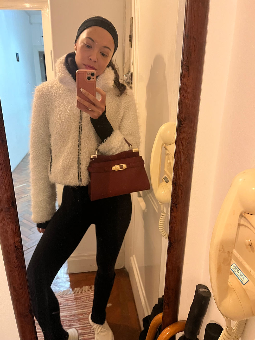 Close-up view of a notebook with Spanish verb conjugations and a pen