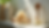 Eye-level view of a natural sugar scrub jar with a wooden spoon on a bathroom shelf
