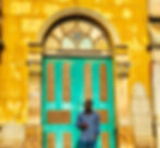 Standing at the gate of the Mosque in Port Novo, Benin