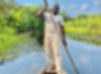 Ola Angel rowing a boat on La Riviere Noire in Benin