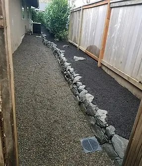 French Drain, Re-Grading and Basalt Rock Retaining Wall 2.webp