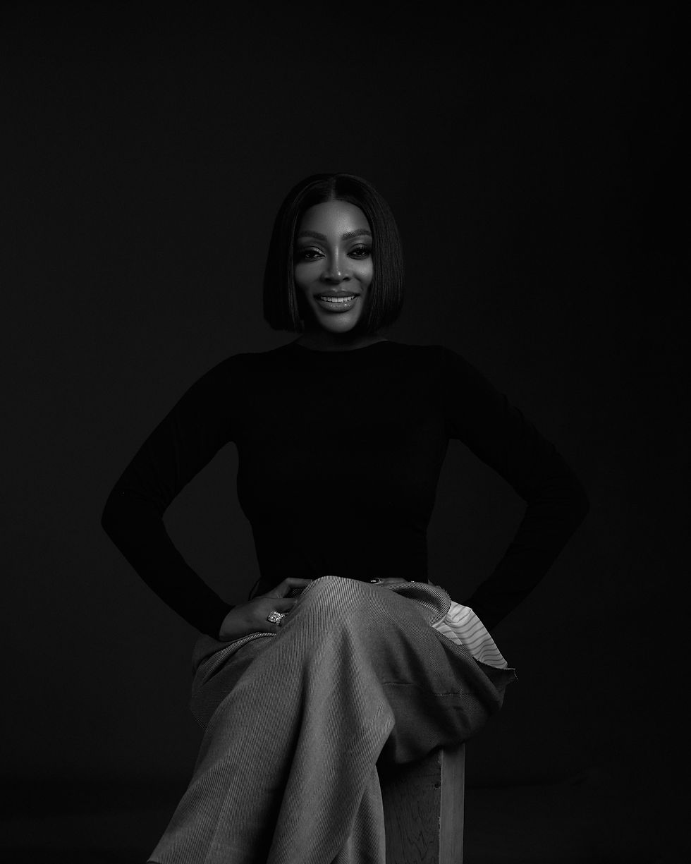 A black and white photo of a woman sitting down