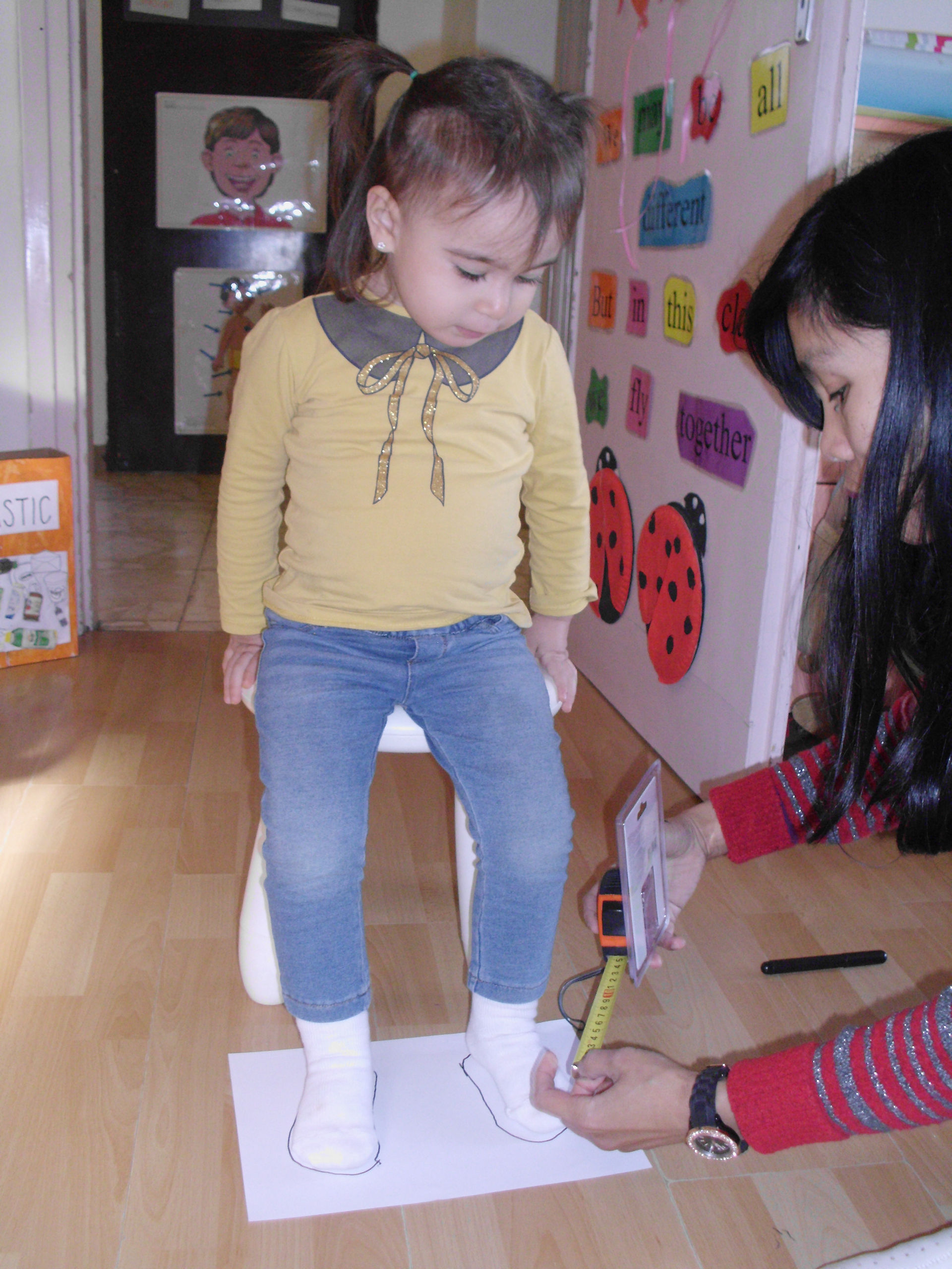 Measure their Feet Day by measuring their own feet