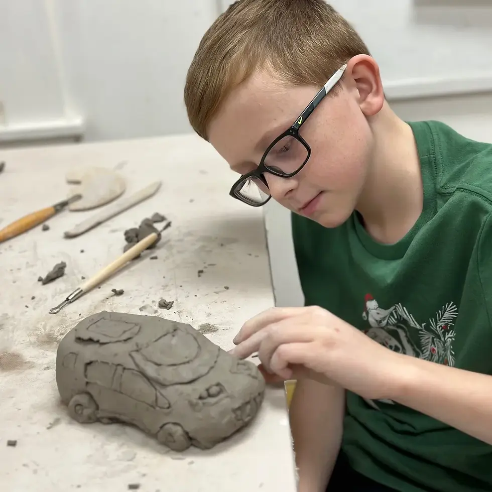 Ck boy with clay car.webp